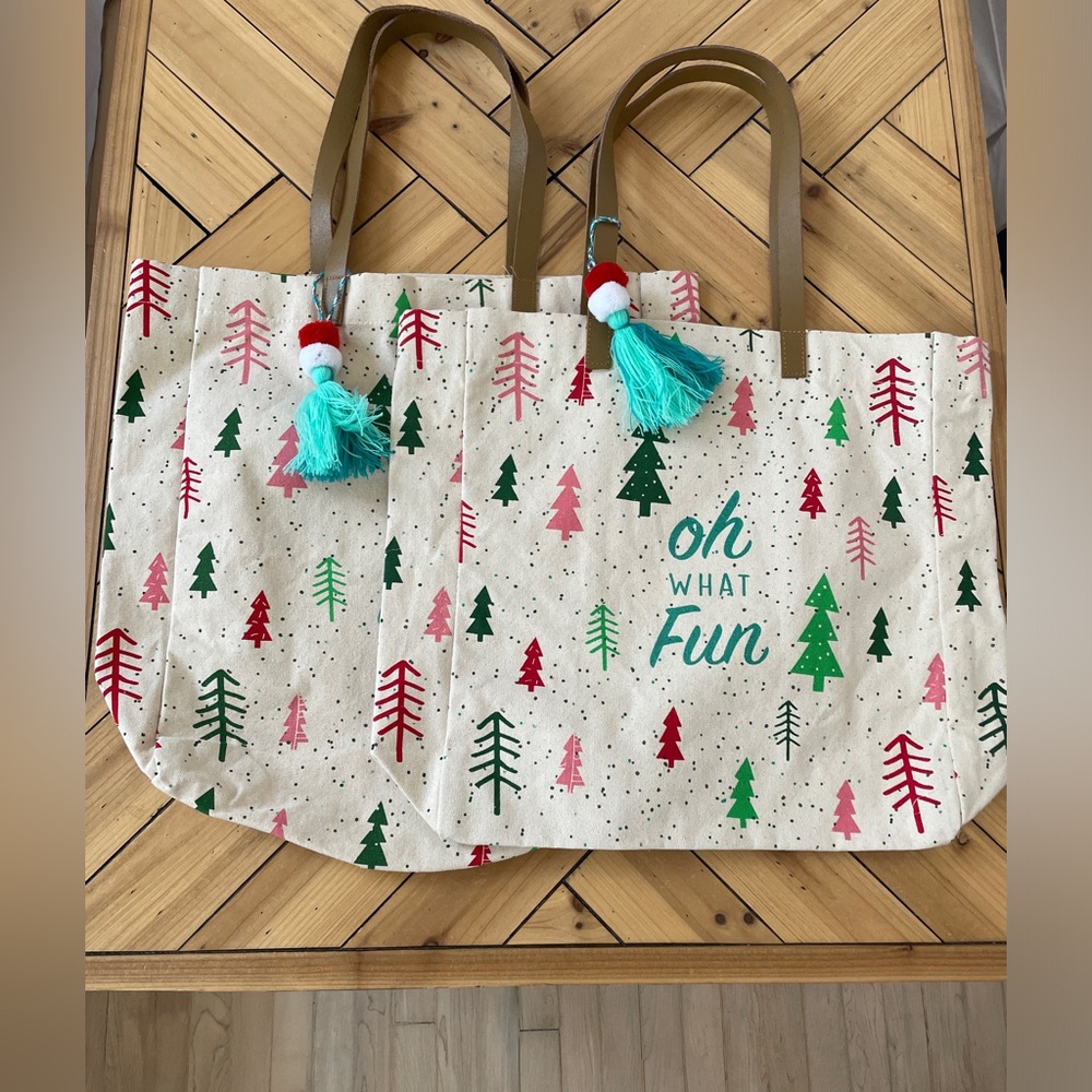 2 holiday shopping bags . Brand new .